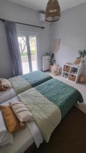 Ένα ή περισσότερα κρεβάτια σε δωμάτιο στο Voulitsa's Apartment
