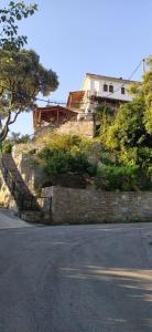 a house on top of a brick wall at To Limanaki in Chorefto