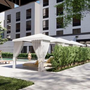 a white canopy in front of a building at Home2 Suites By Hilton Austin East Side in Austin