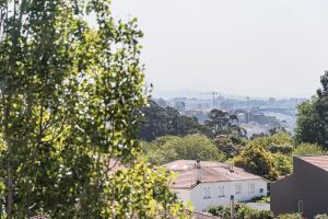 a view of a city with houses and trees at GuestReady - One happy stay in Foz do Douro in Porto