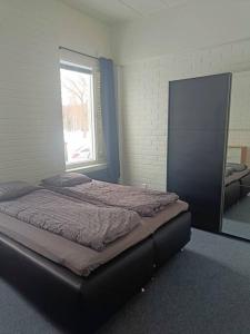 Un pat sau paturi într-o cameră la Casa de Fit, Joensuu