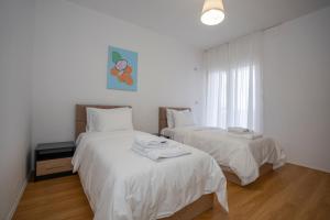 Postel nebo postele na pokoji v ubytování Shkodra Harmony Residences + 37 fotografií