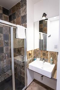 a bathroom with a sink and a shower at B&B Redamare in Trani