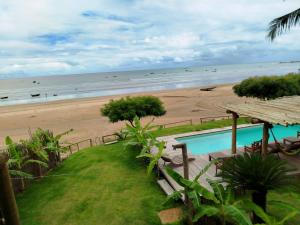 a view of the beach from a resort at Caravelas Praia de Moitas in Amontada