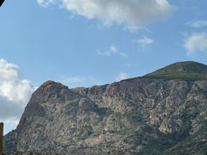a view of a mountain with a blue sky at Mont gozzi in Ajaccio