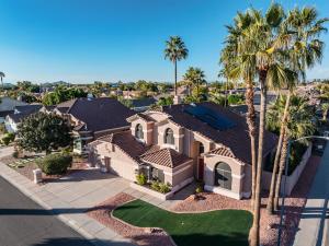 an aerial view of a house with palm trees at Scottsdale Casa del Sol- North Scottsdale with Private Pool, Hot Tub, Putting Green and More! in Phoenix