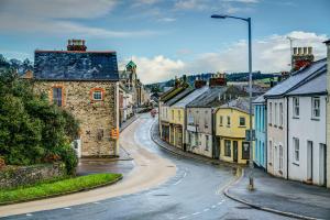 a winding street in a town with buildings at Tiny romantic cottage for two. in Lostwithiel