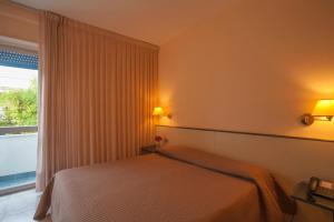 Postel nebo postele na pokoji v ubytování Eden Beach Club