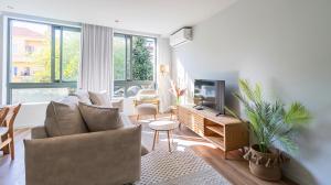 Et tv og/eller underholdning på RUAH Apartments by LovelyStay