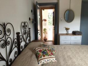 a bedroom with a bed with a pillow on it at Agriturismo La Casa delle Fate in Loiri
