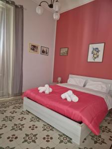 Ένα ή περισσότερα κρεβάτια σε δωμάτιο στο La dimora di Bacchilide