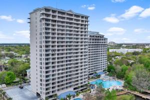 an aerial view of a large white building with a pool at Scenic View Condo Near Disney in Orlando