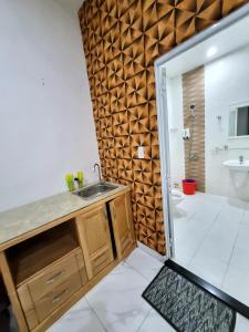 a bathroom with a sink and a shower at Mai Thảo in Vung Tau