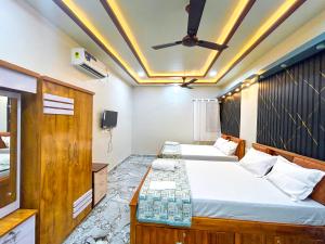 Postel nebo postele na pokoji v ubytování Fraydel HomeStay by JFZ - Honnavara