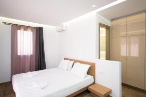 Posteľ alebo postele v izbe v ubytovaní Maistros Apartments Mykonos