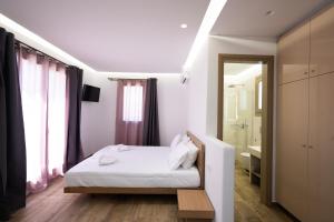 Posteľ alebo postele v izbe v ubytovaní Maistros Apartments Mykonos