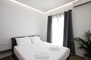 Posteľ alebo postele v izbe v ubytovaní Maistros Apartments Mykonos
