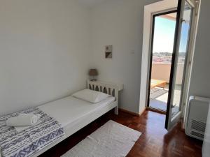 Postel nebo postele na pokoji v ubytování Apartment Oscar