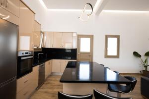 Kuchyňa alebo kuchynka v ubytovaní Maistros Apartments Mykonos