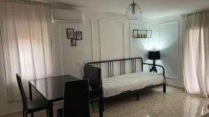 A bed or beds in a room at Santa Lucia Affittacamere