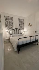 A bed or beds in a room at Santa Lucia Affittacamere