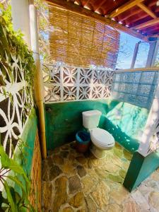 a bathroom with a toilet in a building at Casa Real Quetzalcóatl in Puerto Escondido