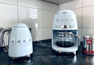 two blenders sitting on a counter in a kitchen at Lakefront View Entire Apartment with 2 bedrooms, 2 full bathrooms & Balcony Waterview in Reichenau