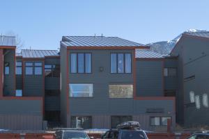 a row of houses with cars parked in front of them at Spacious 3 bedroom Condo Easy walk to Grocery Store and Chairlift 7 in Telluride