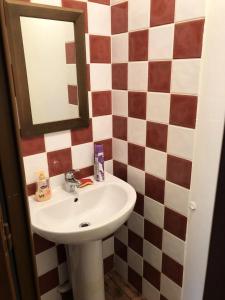 a bathroom with a sink and a mirror at Les Chalets Valoria - 3 Pièces pour 6 Personnes 54 in Valloire