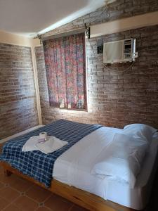 Ένα ή περισσότερα κρεβάτια σε δωμάτιο στο Residencia cerca del mar