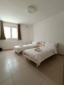 Posteľ alebo postele v izbe v ubytovaní Cosy 2bed Apartment In Manikata By Homely