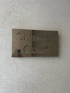 a sign that says christchurch court on a wall at Cosy 2bed Apartment In Manikata By Homely in Mellieħa
