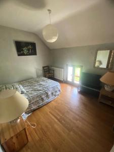 a bedroom with a bed and a wooden floor at Résidence Lavoir - Maisons & Villas 424 in Villard-de-Lans