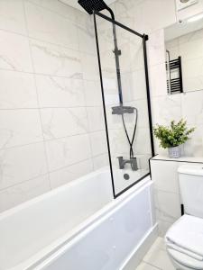 a bathroom with a tub and a toilet at Fantastic Home! Football Fans -5 min to Stadium in Liverpool