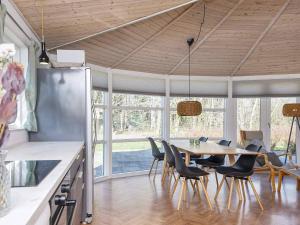 a kitchen and dining room with a table and chairs at 4 star holiday home in Ansager-By Traum in Ansager