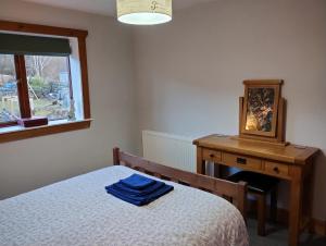 Ліжко або ліжка в номері Kintail Cottage