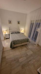 Postel nebo postele na pokoji v ubytování Luxury Apartamentos Jardin Botanico