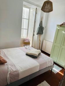 Ліжко або ліжка в номері Charmante Maison de village