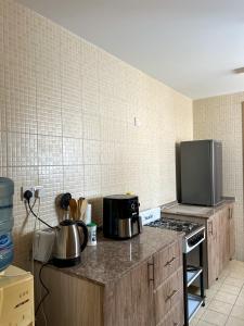 a kitchen with two pots and pans on a counter at SIRA apartment 1 in Muscat