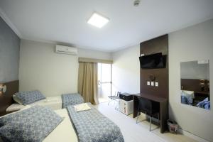 TV a/nebo společenská místnost v ubytování Hotel Universitario