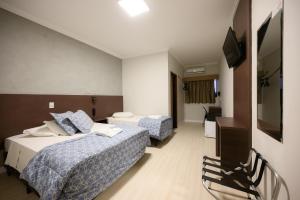 TV a/nebo společenská místnost v ubytování Hotel Universitario