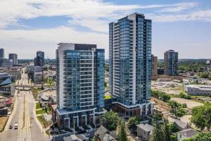 an aerial view of a city with tall buildings at Modern 1BR King Bed Condo - Private Balcony in Kitchener