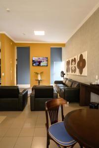 TV a/nebo společenská místnost v ubytování Hotel Universitario
