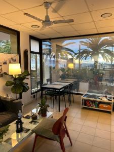 a living room with a table and a dining room at NC Hostel in Las Palmas de Gran Canaria