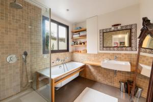 a bathroom with a tub and a sink and a shower at Spectacular Family Home with GardenOlympiades in Paris