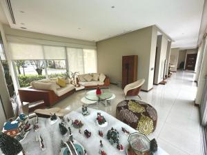 a living room with a couch and a table at casa en samborondon in Guayaquil