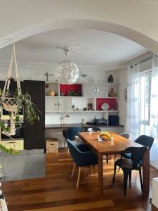 a kitchen and dining room with a table and chairs at Beautiful & Spacious 3BD Family Home w Terrace in Paris