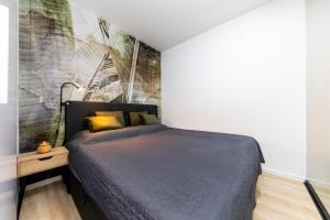 A bed or beds in a room at ERKEL 18 APARTMAN