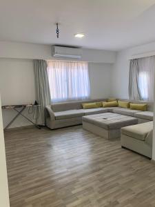 a large living room with couches and a television at Apartman Al Dora Resindence in Hurghada +34 photos