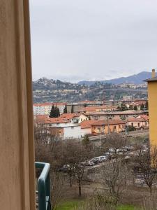 a view of a city from a window at Coco Apartment in Bergamo